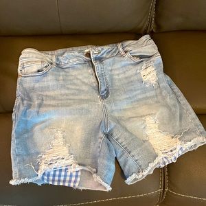Torrid distressed denim shorts.